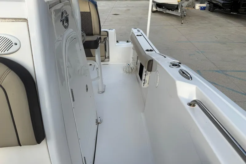 Slide: The Image of 2021 Tidewater 232 CC Adventure boat interior with seating and storage compartments. - 13