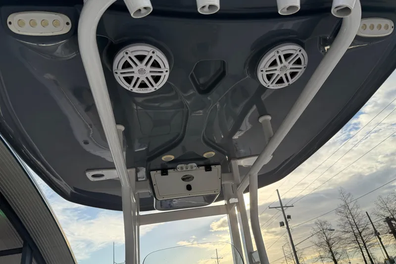 Slide: The Image of Tidewater 232 CC Adventure 2021 boat roof with speakers and rod holders. - 16