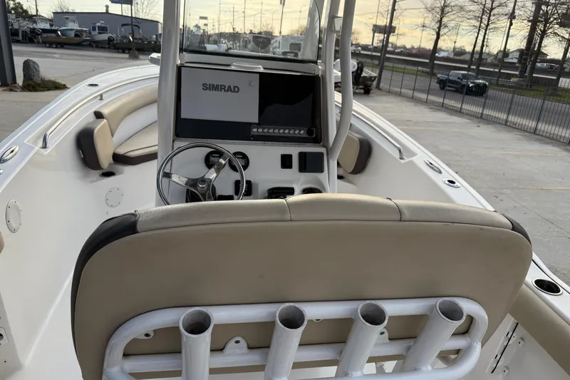 Slide: The Image of 2021 Tidewater 232 CC Adventure boat interior with Simrad display and rod holders. - 17