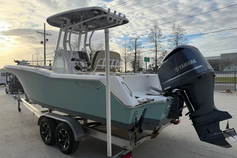 Slide: The Image of 2021 Tidewater 232 CC Adventure boat with Yamaha engine on trailer, parked outdoors. - 4