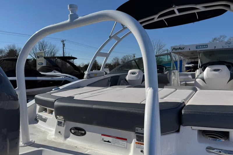 Slide: The Image of 2019 Chaparral 21 H2O Sport OB boat interior with seating and wakeboard tower. - 15