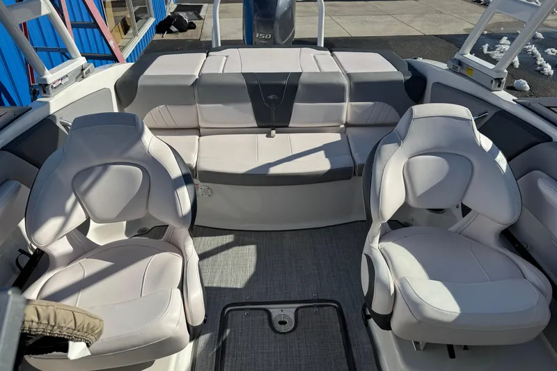 Slide: The Image of 2019 Chaparral 21 H2O Sport OB boat interior with white seating and modern design. - 18
