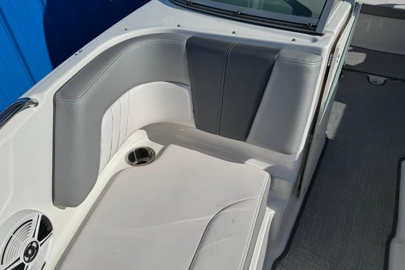 Slide: The Image of 2019 Chaparral 21 H2O Sport OB boat interior with gray and white seating. - 26