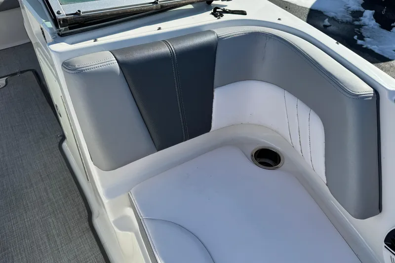 Slide: The Image of 2019 Chaparral 21 H2O Sport OB boat interior seating with gray and white upholstery. - 27