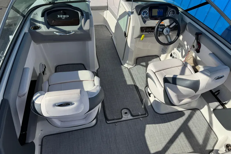 Slide: The Image of 2019 Chaparral 21 H2O Sport OB boat interior with modern dashboard and seating. - 5