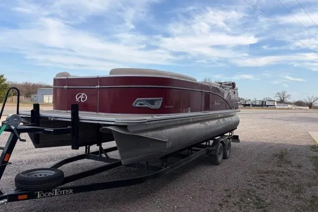 Slide: The Image of 2014 Avalon Catalina Cruise 22' pontoon boat on trailer under a blue sky. - 3