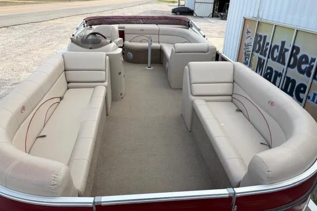 Slide: The Image of 2014 Avalon Catalina Cruise 22' pontoon boat with spacious seating and beige upholstery. - 6
