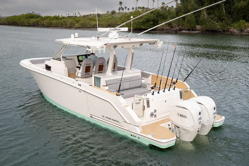 Slide: The Image of Manufacturer Provided Image: 2026 Regal 34 SAV boat with dual Yamaha engines on calm water. - 3