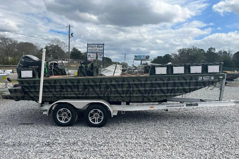 The Image of 2024 Other 1870 Bowfish boat on trailer, parked outdoors under cloudy sky. - 1