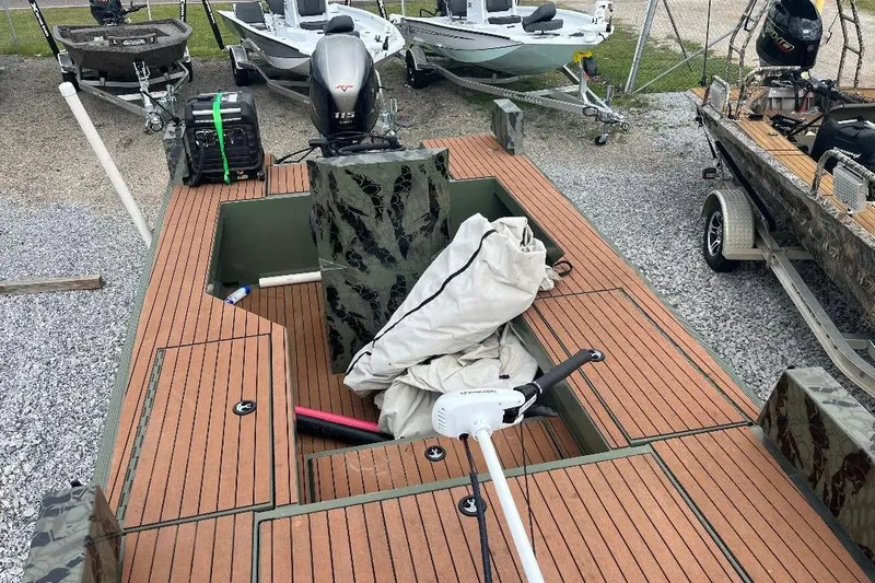 Slide: The Image of 2024 Other 1870 Bowfish boat with wooden deck, motor, and equipment on trailer. - 7