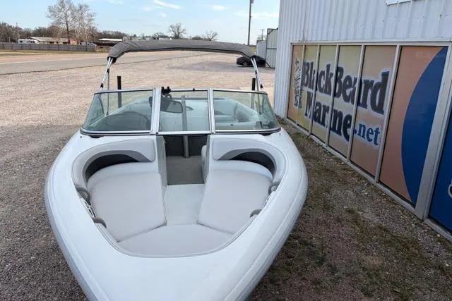 Slide: The Image of 2002 Moomba Outback boat parked near Blackbeard Marine sign. - 2
