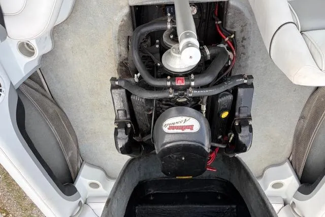 Slide: The Image of 2002 Moomba Outback boat engine compartment with visible components and wiring. - 9