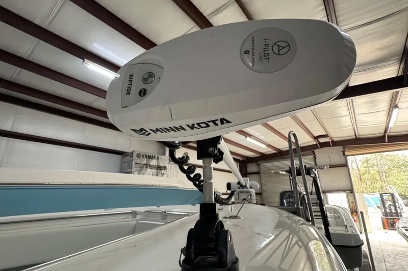 Slide: The Image of Minn Kota Riptide motor on 2021 Contender 25 Tournament boat in a garage. - 10