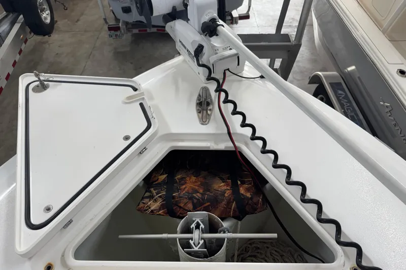 Slide: The Image of Bow of 2021 Contender 25 Tournament boat with anchor storage and trolling motor. - 18