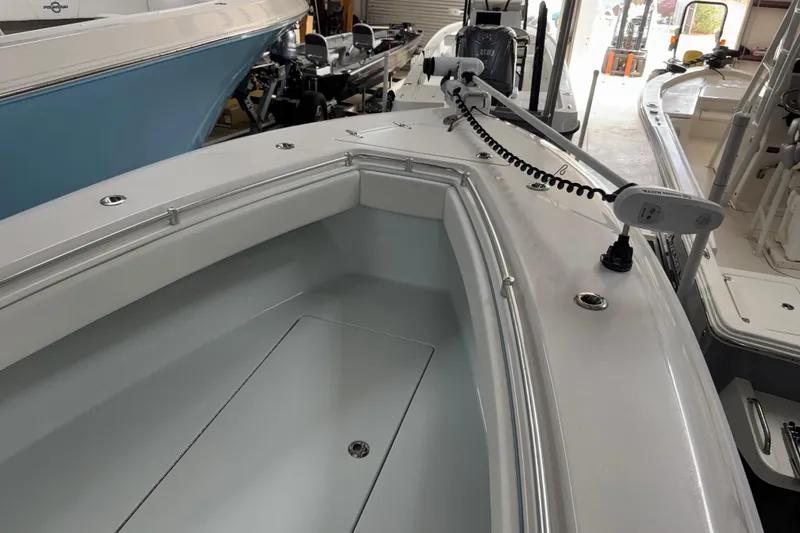 Slide: The Image of 2021 Contender 25 Tournament boat interior with modern features in a showroom. - 21
