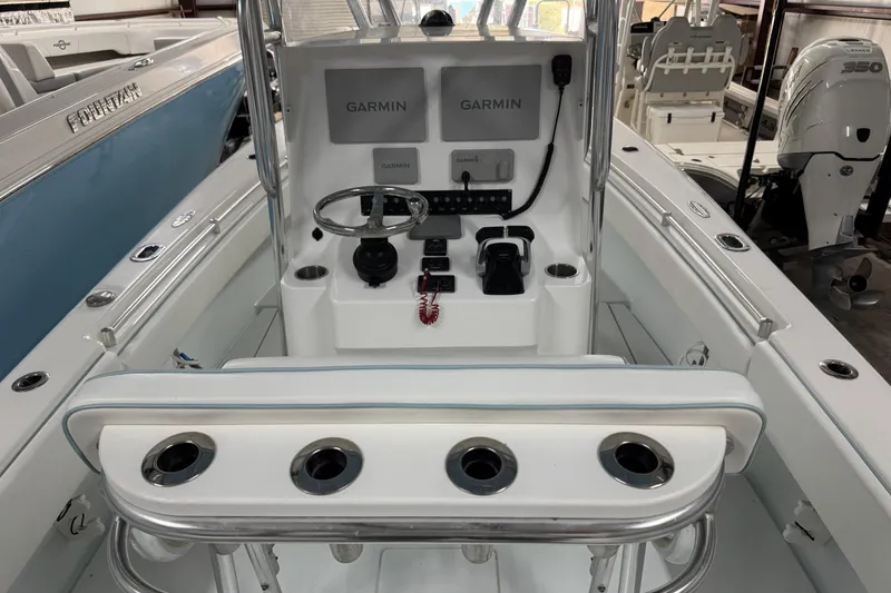 Slide: The Image of 2021 Contender 25 Tournament boat cockpit with Garmin electronics and steering wheel. - 22
