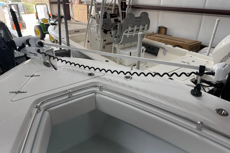 Slide: The Image of 2021 Contender 25 Tournament boat with Minn Kota trolling motor in a storage facility. - 24