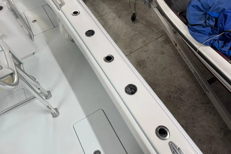 Slide: The Image of 2021 Contender 25 Tournament boat interior with rod holders and seating. - 25
