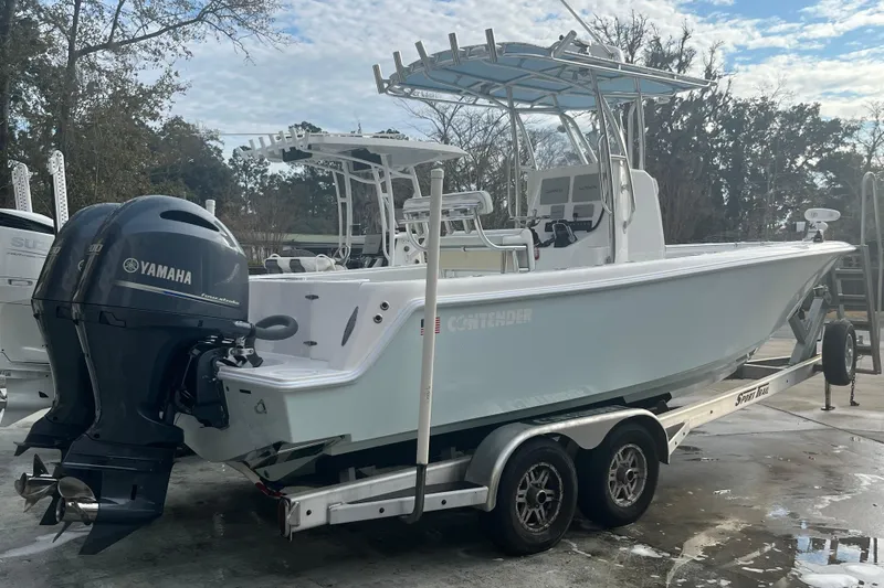 Slide: The Image of 2021 Contender 25 Tournament boat with Yamaha engines on a trailer. - 27