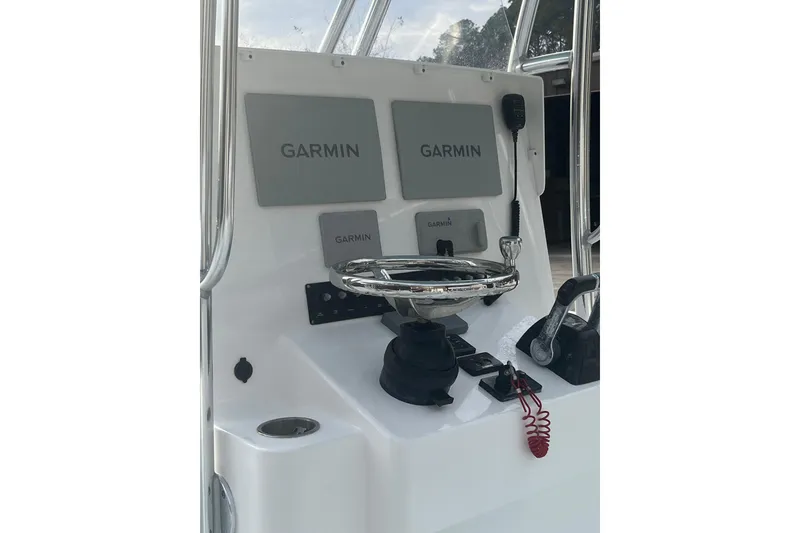 Slide: The Image of 2021 Contender 25 Tournament boat console with Garmin navigation system and steering wheel. - 29