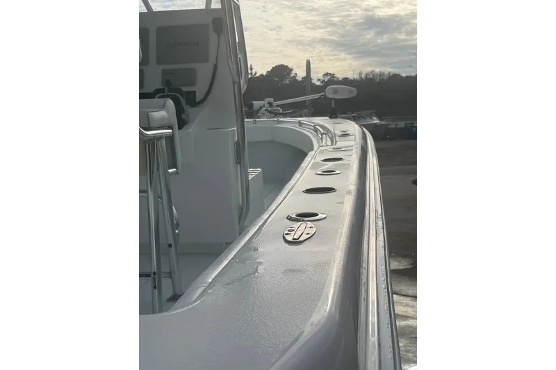 Slide: The Image of 2021 Contender 25 Tournament boat deck with rod holders and console view. - 31