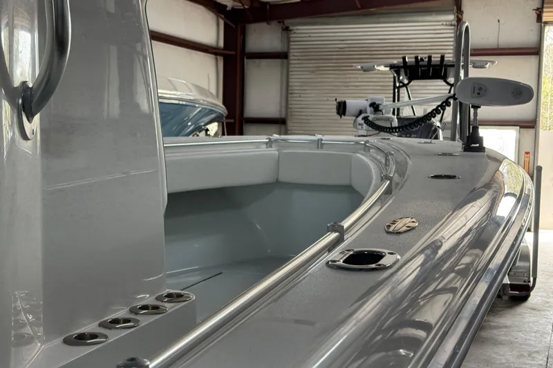 Slide: The Image of 2021 Contender 25 Tournament boat in a garage, showcasing sleek design and equipment. - 5