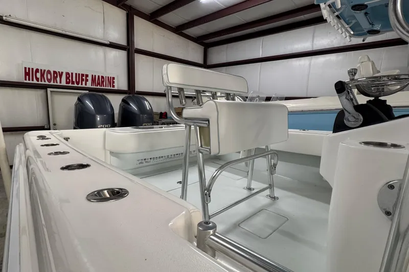 Slide: The Image of 2021 Contender 25 Tournament boat interior at Hickory Bluff Marine, featuring dual engines. - 6