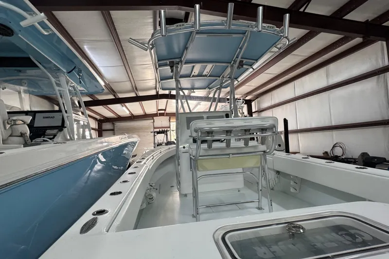 Slide: The Image of 2021 Contender 25 Tournament boat in storage, featuring sleek design and modern equipment. - 9