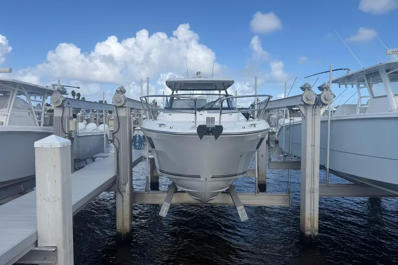 Slide: The Image of 2022 Jeanneau Leader 10.5 WA Series 2 boat docked at marina under blue sky. - 1