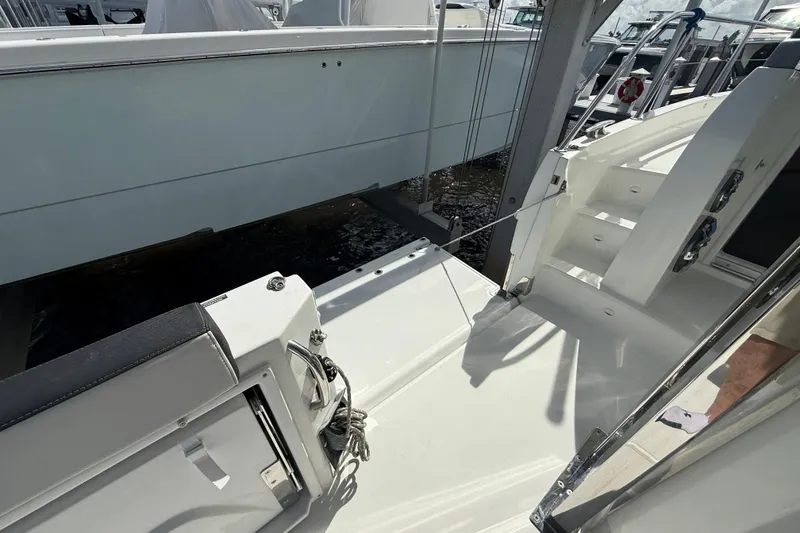 Slide: The Image of 2022 Jeanneau Leader 10.5 WA Series 2 boat deck with seating and steps. - 11