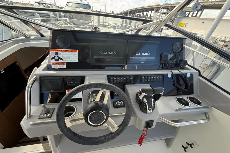 Slide: The Image of 2022 Jeanneau Leader 10.5 WA Series 2 helm with Garmin navigation displays. - 14