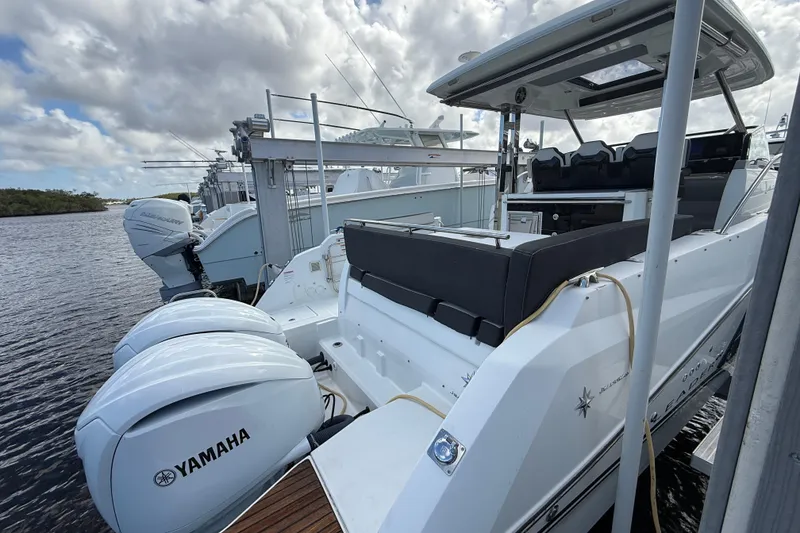 Slide: The Image of 2022 Jeanneau Leader 10.5 WA Series 2 boat docked with Yamaha engines. - 4