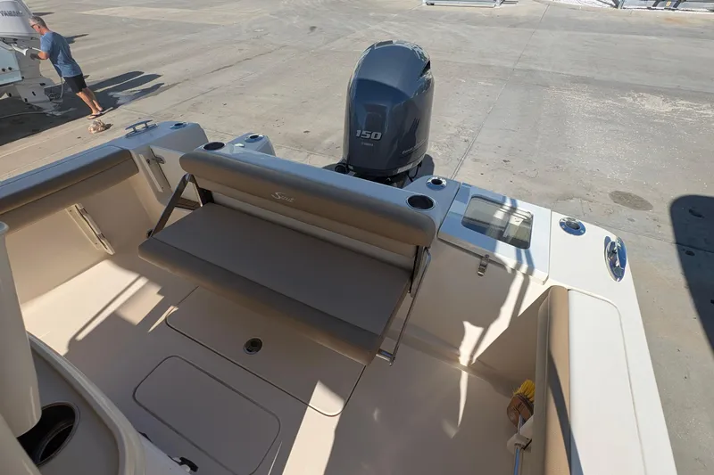 Slide: The Image of 2019 Scout 215 XSF boat with Yamaha 150 engine, featuring a spacious seating area. - 14