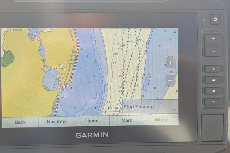 Slide: The Image of Garmin navigation display on 2019 Scout 215 XSF boat, showing coastal map and controls. - 20