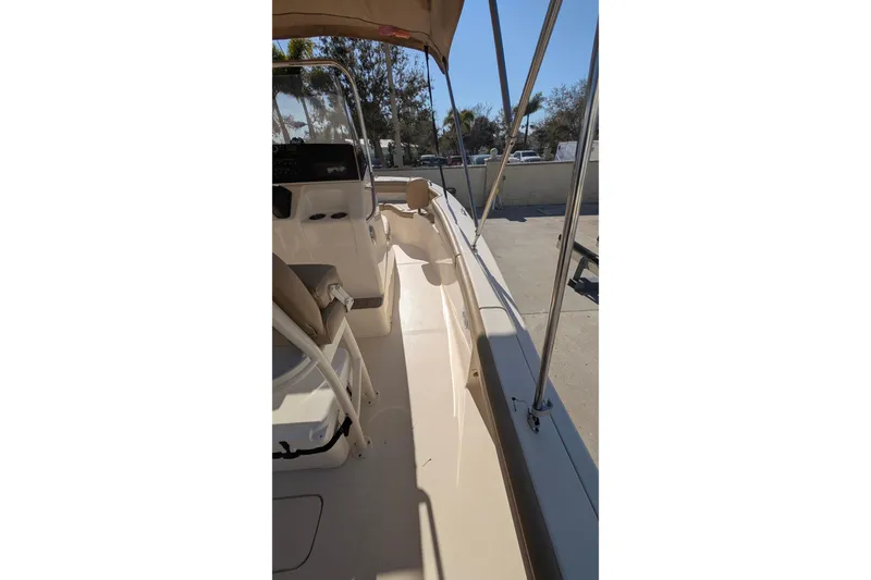 Slide: The Image of 2019 Scout 215 XSF boat interior with seating and canopy. - 25