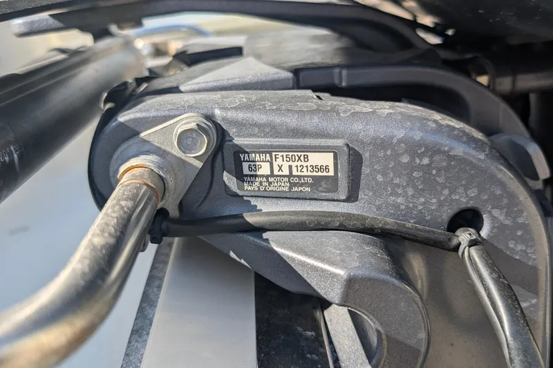 Slide: The Image of Close-up of Yamaha F150XB engine part on 2019 Scout 215 XSF boat. - 39