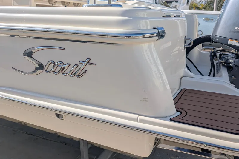 Slide: The Image of 2019 Scout 215 XSF boat with sleek design and chrome detailing. - 7