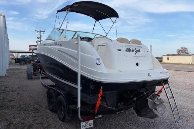 Slide: The Image of 2008 Sea Ray 240 Sundancer boat on trailer, featuring "Life is Good" text on the stern. - 4