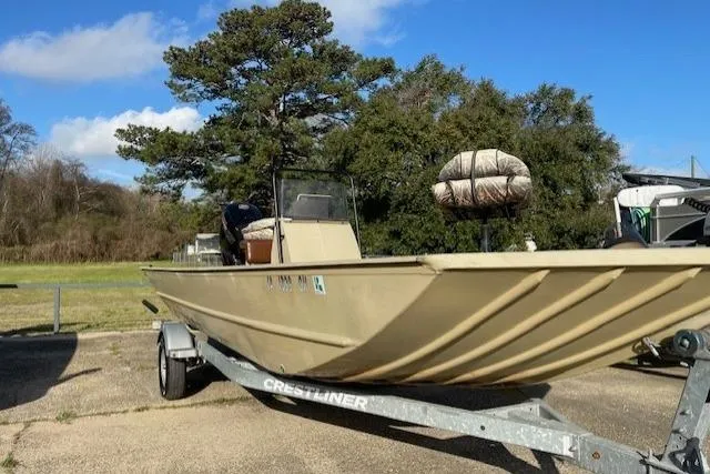 Slide: The Image of 2017 Crestliner 2070 Retriever CC boat on trailer, parked outdoors under clear sky. - 4