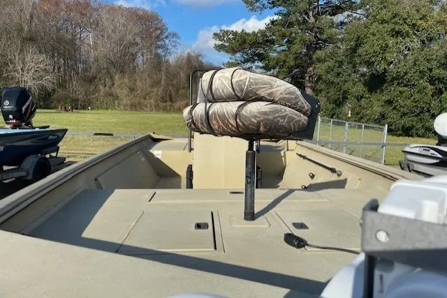 Slide: The Image of 2017 Crestliner 2070 Retriever CC boat with camo seat, outdoors. - 5