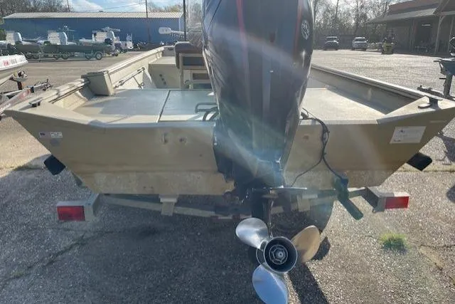 Slide: The Image of 2017 Crestliner 2070 Retriever CC boat with outboard motor, parked outdoors. - 7