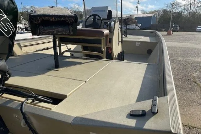 Slide: The Image of 2017 Crestliner 2070 Retriever CC boat, spacious deck, steering console, parked outdoors. - 9