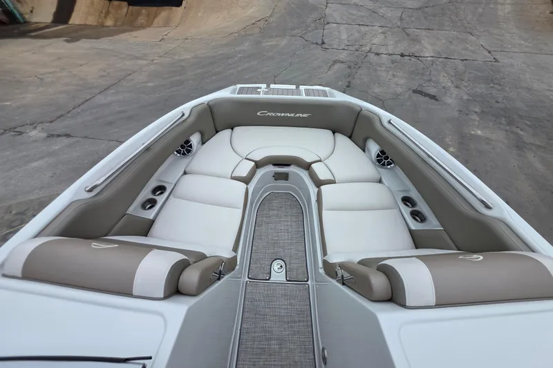 Slide: The Image of 2022 Crownline Eclipse E255 boat interior with beige and white seating. - 71
