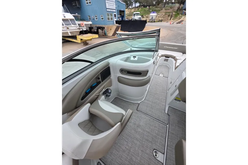 Slide: The Image of 2022 Crownline Eclipse E255 boat interior with seating and dashboard view. - 75