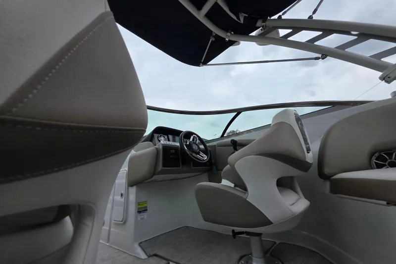 Slide: The Image of Interior view of 2022 Crownline Eclipse E255 boat, featuring modern helm and seating. - 78