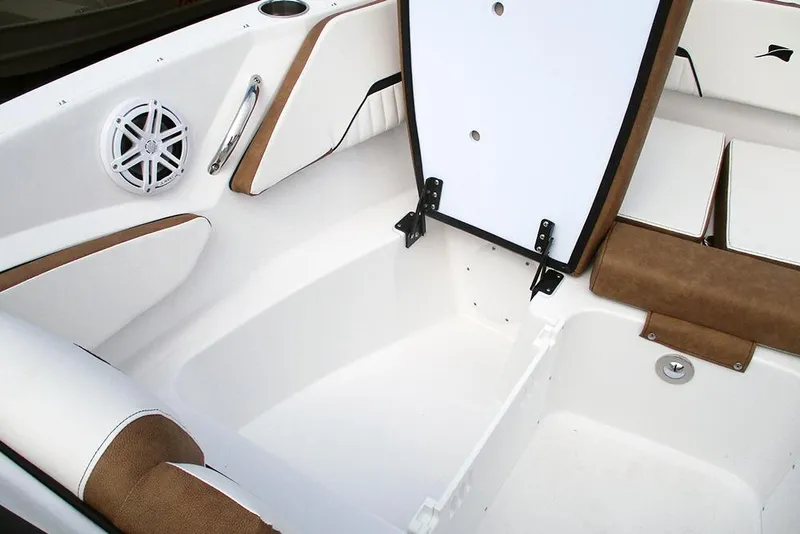 Slide: The Image of 2026 Stingray 20 SBX boat interior with storage compartment and speaker. - 16