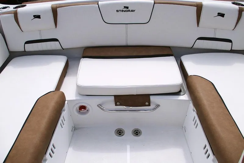 Slide: The Image of 2026 Stingray 20 SBX boat interior with white and brown seating. - 21