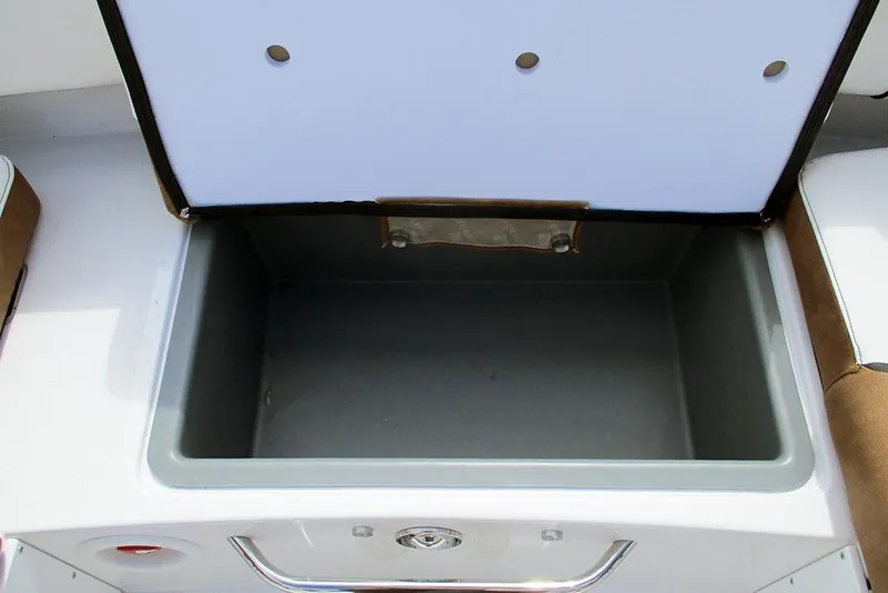Slide: The Image of Open storage compartment in 2026 Stingray 20 SBX boat interior. - 23