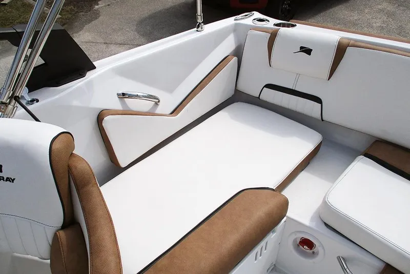 Slide: The Image of 2026 Stingray 20 SBX boat interior with white and brown seating, modern design. - 24