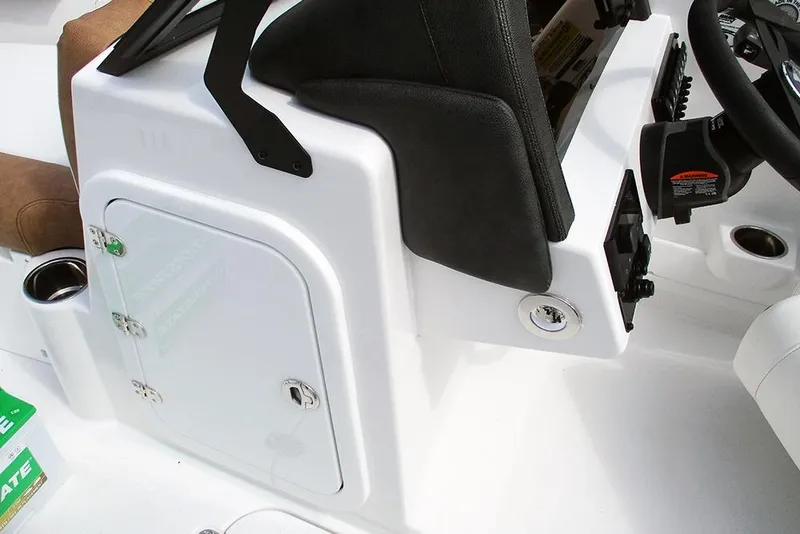 Slide: The Image of 2026 Stingray 20 SBX boat console with storage compartment and steering controls. - 33